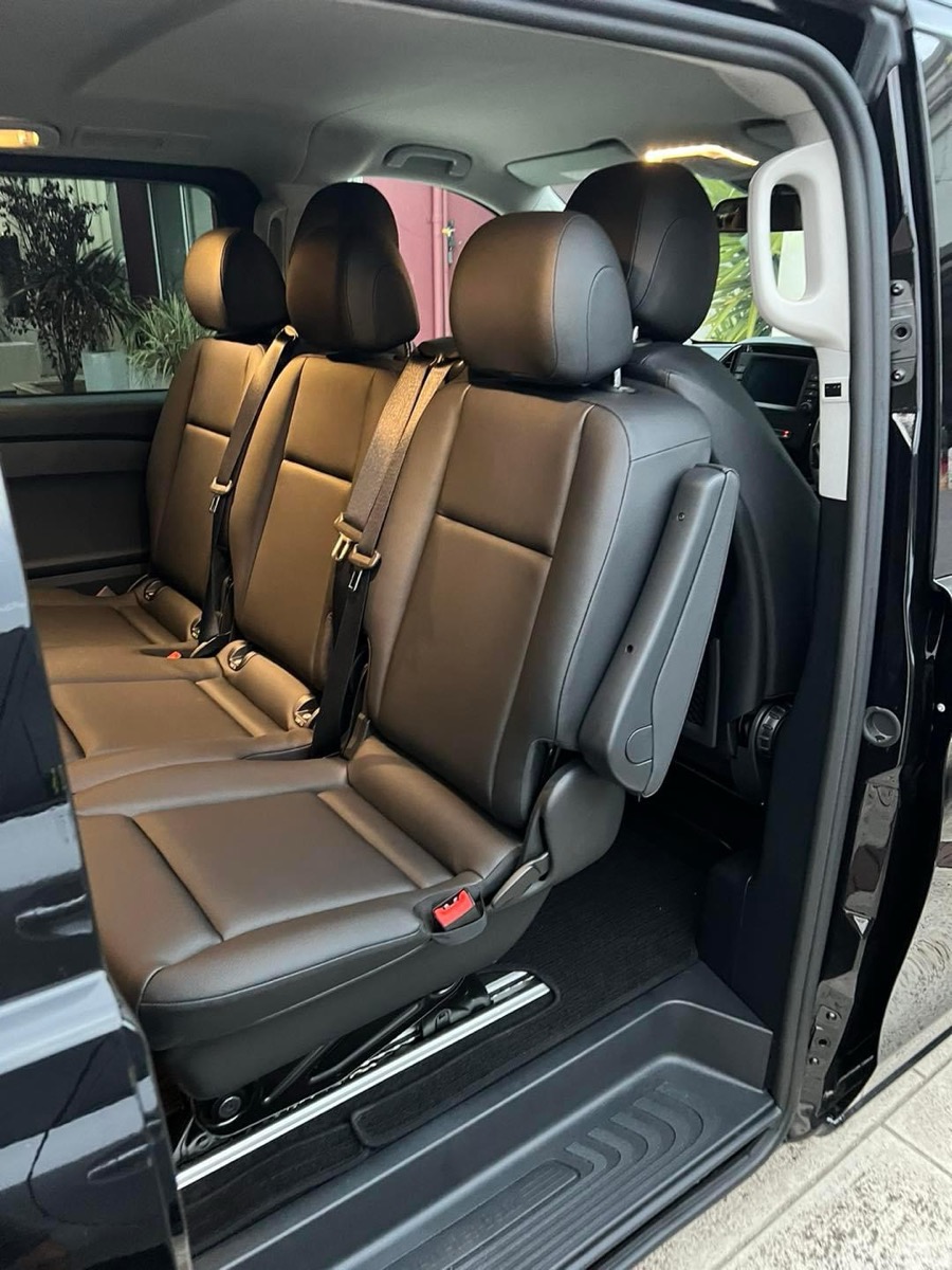 Leather seats inside our private transfer van